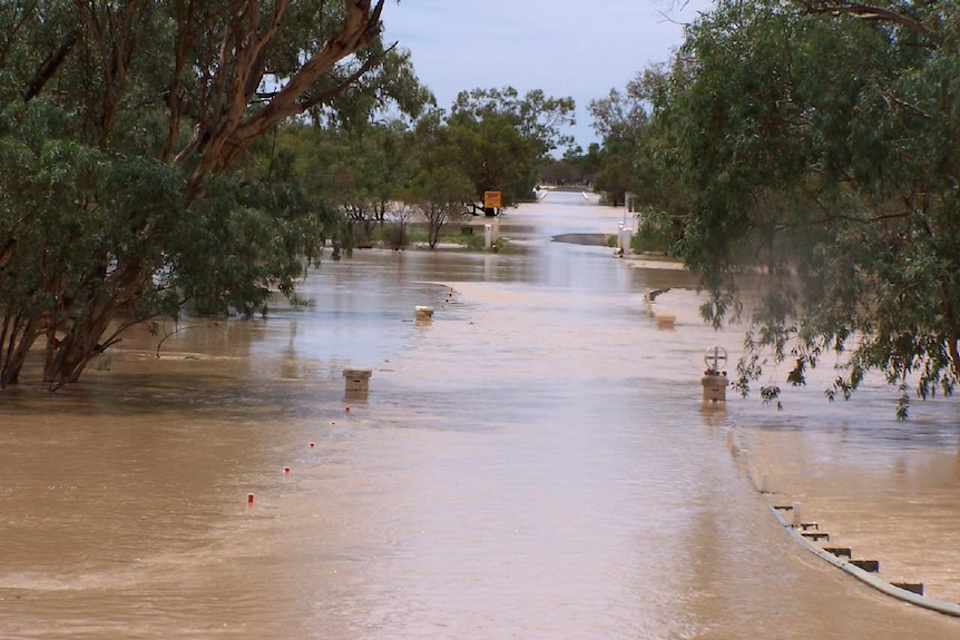 A bridge covered by floodwaters