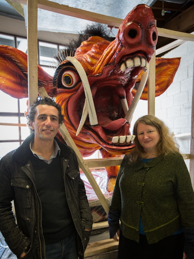 Tasmanian College of the Arts director, John Vella with Asian Studies lecturer, Dr Kaz Ross and a monster in the background.