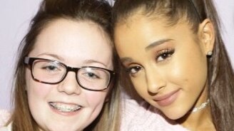 Georgina Callander hugs singer Ariana Grande.