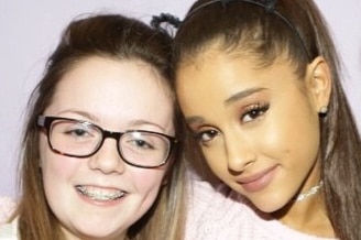 Georgina Callander hugs singer Ariana Grande.