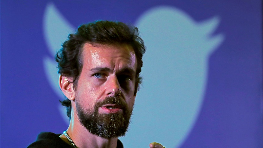 Twitter CEO Jack Dorsey in front of a poster of the Twitter bird icon during an address in New Delhi, November 2018.