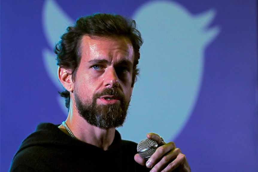 Twitter CEO Jack Dorsey in front of a poster of the Twitter bird icon during an address in New Delhi, November 2018.