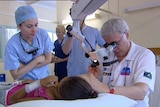 TV still of doctor performing ear operation on anonymous Indigenous girl at Cherbourg in southern Ql