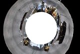 A 360-degree shot of the far side of the moon shows the grey moonscape, the lander and the rover.