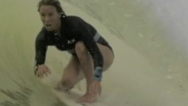 Close up shot of Australian surfer Sally Fitzgibbons in the tube at Kelly Slater's Surf Ranch.