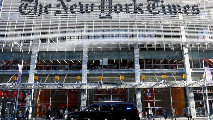 The Trump motorcade drives past the New York Times