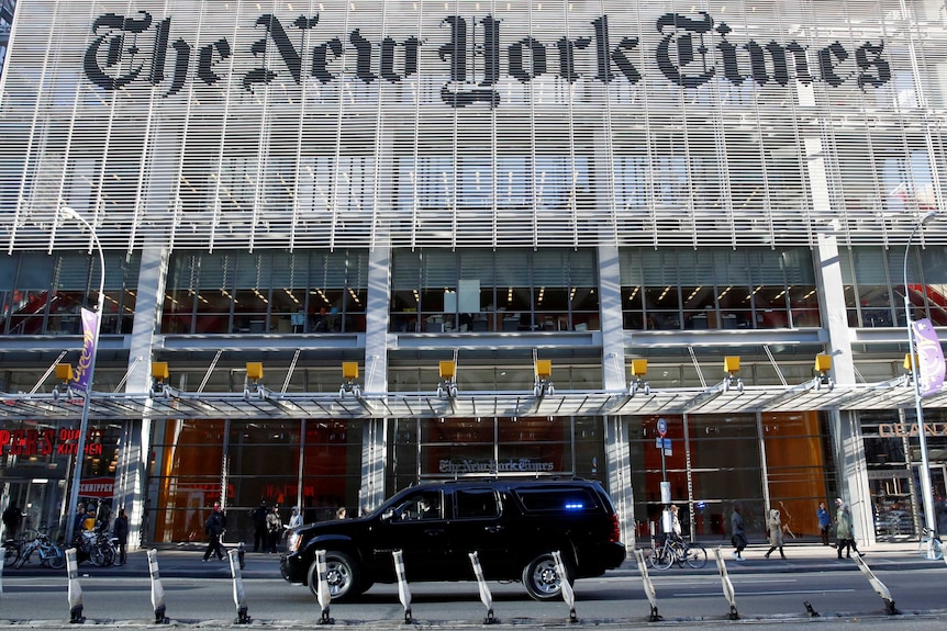 The Trump motorcade drives past the New York Times