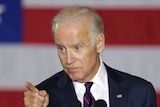 US Vice President Joe Biden stands at a podium while speaking at a campaign rally.