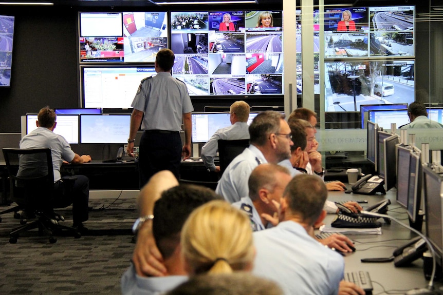 Police work in the G20 Operations Centre at the Queensland Police HQ at Roma Street, Brisbane.