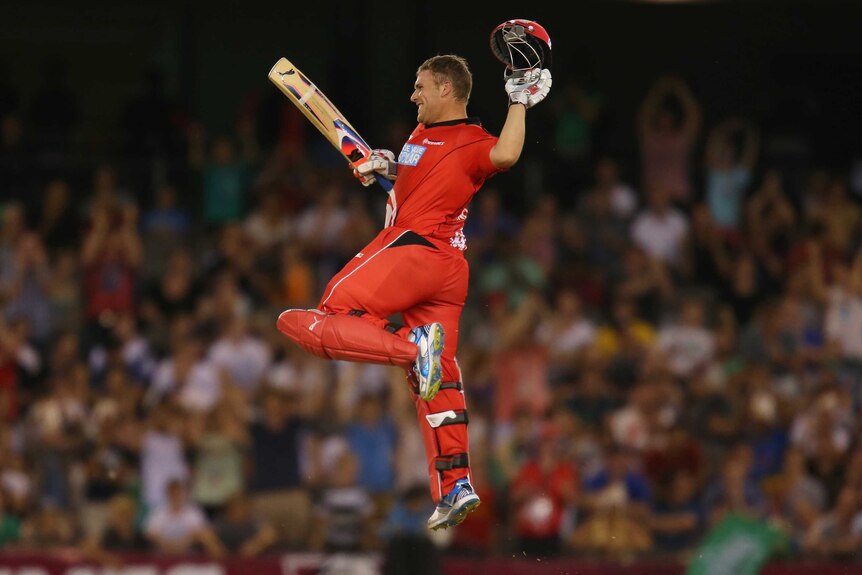 On song ... Aaron Finch celebrates as he reaches his century