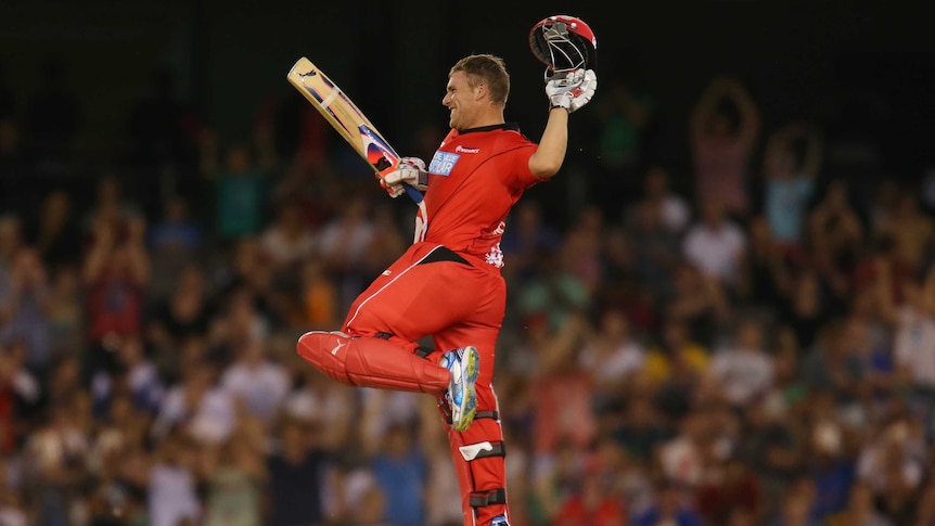 On song ... Aaron Finch celebrates as he reaches his century