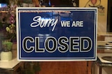 A closed sign on a shop