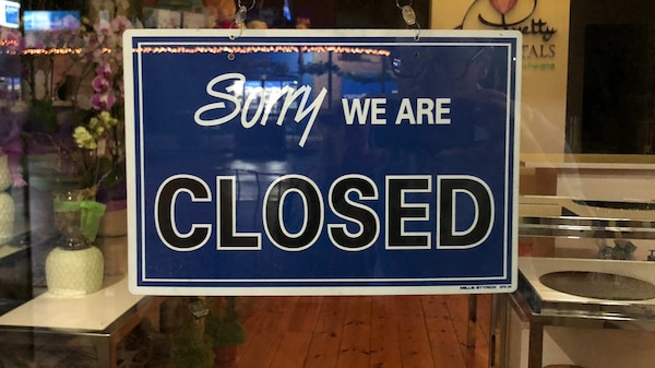 A closed sign on a shop