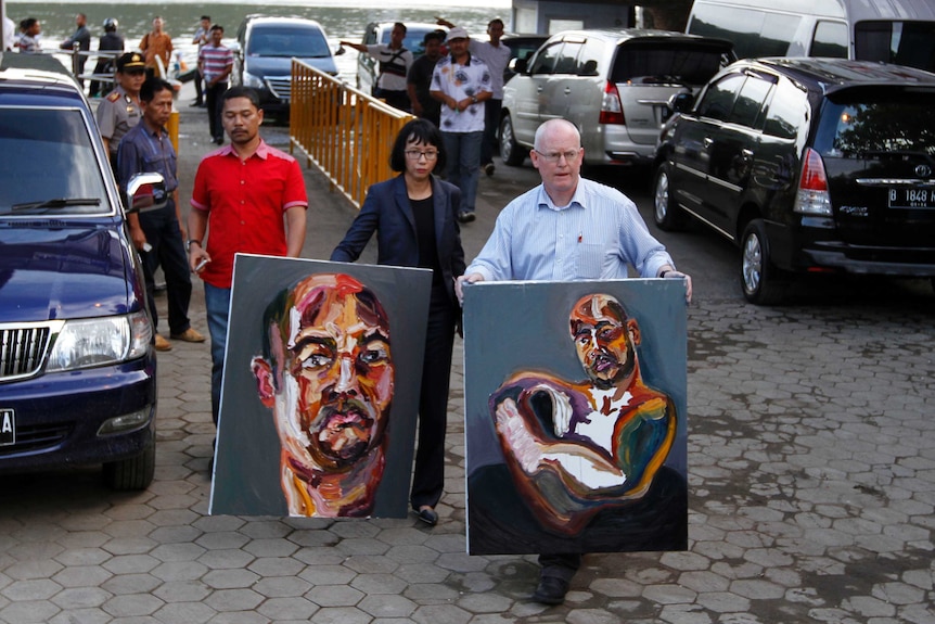 ONE TIME USE Bali Nine Lawyer Julian McMahon carries Myuran Sukumaran paintings