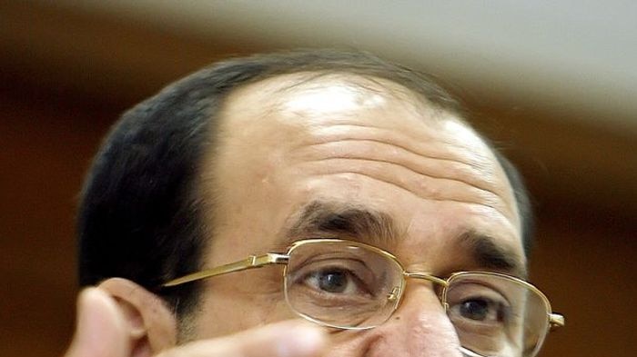 Iraqi Prime Minister Nuri al-Maliki gestures during a press conference.