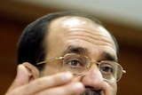 Iraqi Prime Minister Nuri al-Maliki gestures during a press conference.