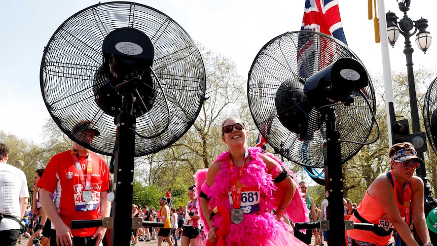 Runners stand in front of fans after finishing the London Marathon. April 22, 2018.