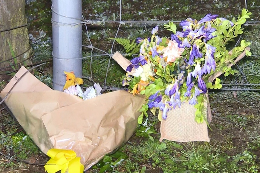 Two bunches of flowers lying on the ground