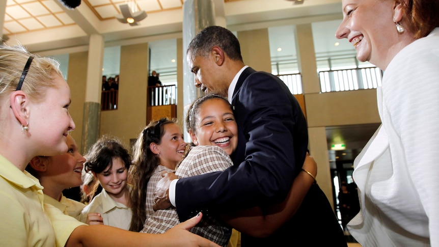 Obama gets a hug from schoolgirl