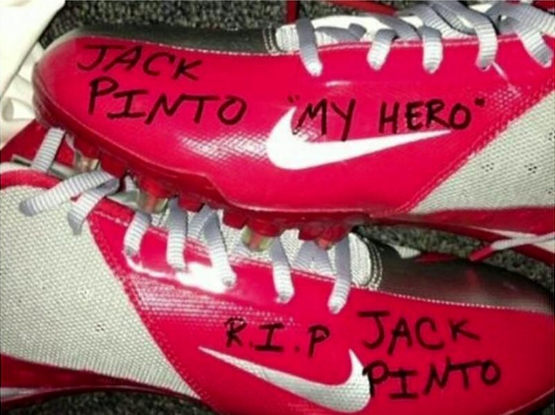 Messages of tribute for Newtown shooting victim Jack Pinto on the boots of Victor Cruz.