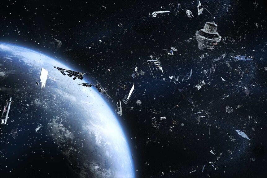 Space junk, bits of metal and satellites floating in space, with part of the Earth visible in the lower left corner.
