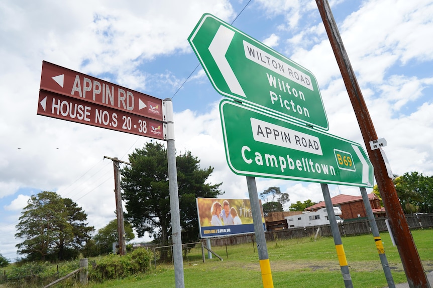 A collection of road signs pointing towards Wilton, Picton and Campbelltown