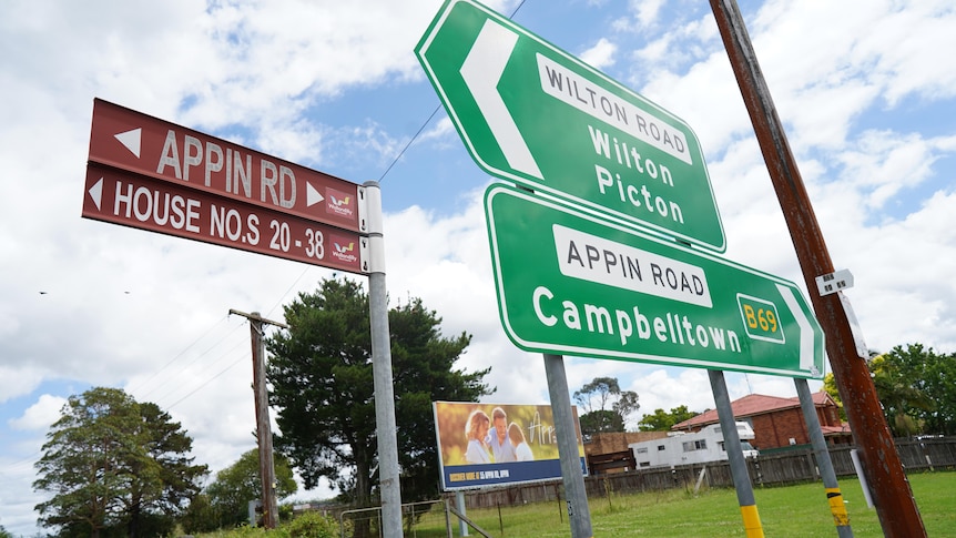 A collection of road signs pointing towards Wilton, Picton and Campbelltown