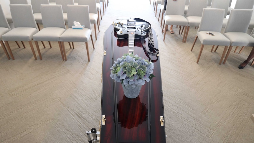 A guitar on a coffin
