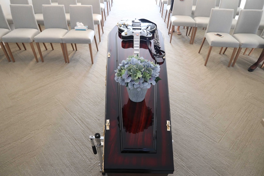 A guitar on a coffin