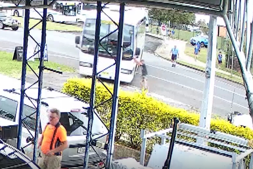 A screencap of CCTV footage showing the moment a bus started moving towards a petrol station at Casino, NSW.