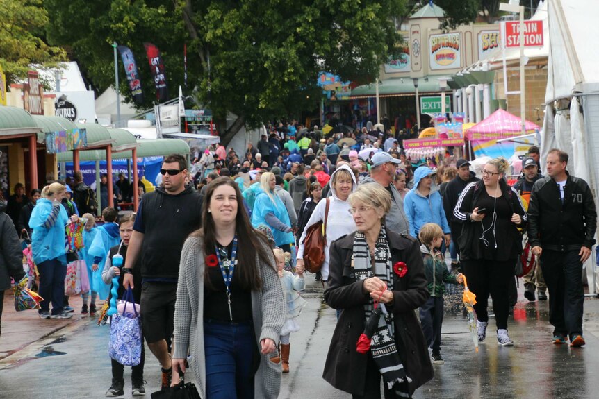A crowd of people walking around the Perth Royal Show.