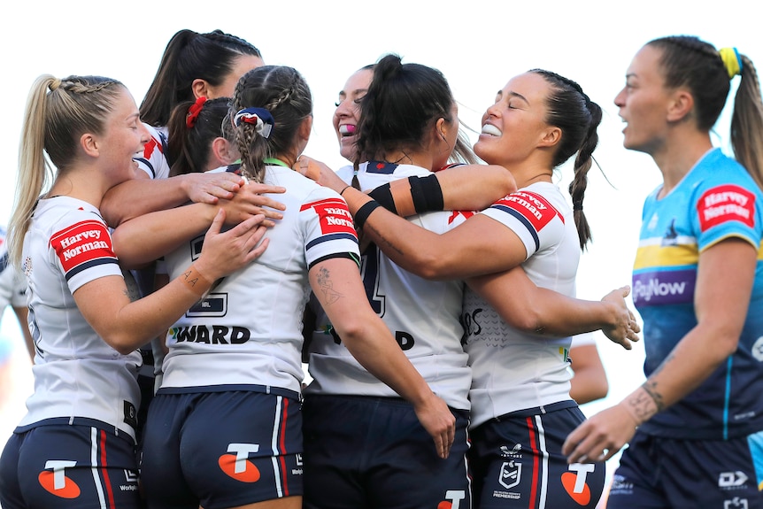 Sydney Roosters NRLW players celebrate a try against Gold Coast.