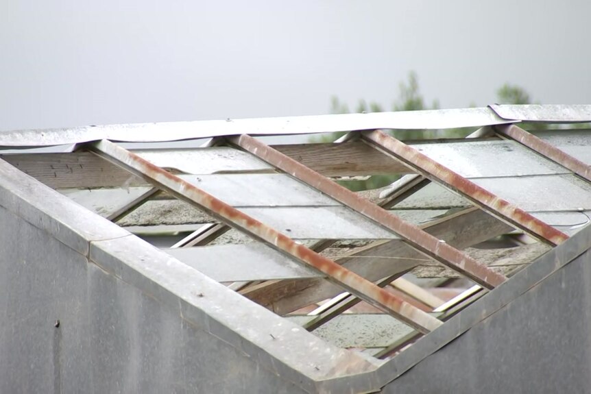 A damaged roof of a glasshouse