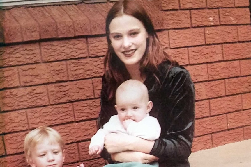 Belinda Peisley with her two sons and dog.