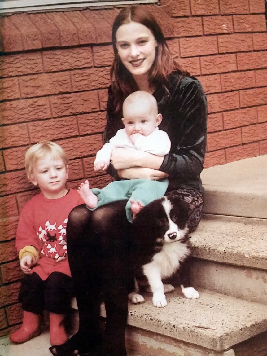 Belinda Peisley with her two sons and dog.