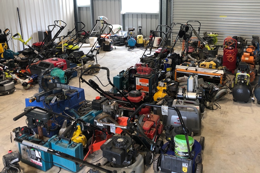 A collection of various tools in a shed.