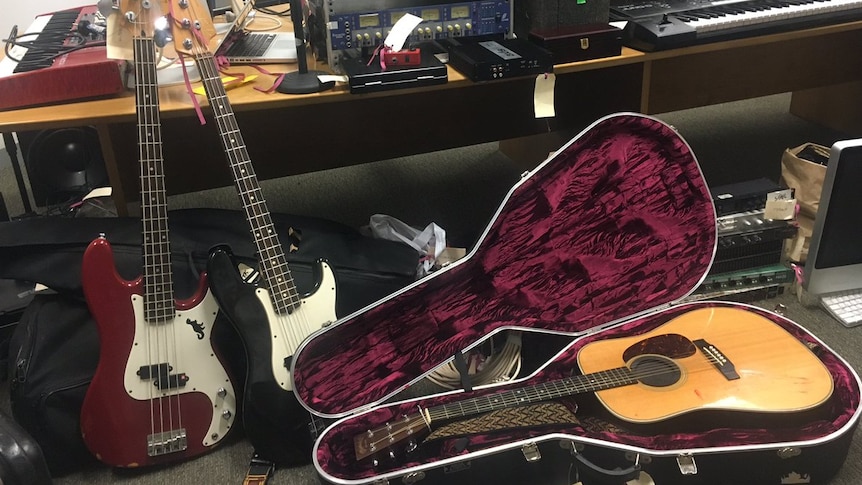 A haul of stolen music equipment spread out in an office.