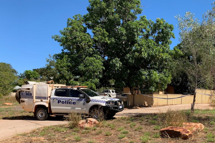 Image of a police wagon, parked out the front of a cordoned off crime scene in Broome.