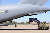 An RAAF C-17 is loaded with supplies