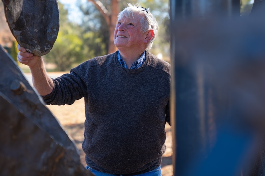 Alf Cantrell standing with sculpture of Henry Moore in Yeoval, NSW.