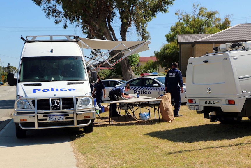 Police cars and equipment outside the Madora Bay home.