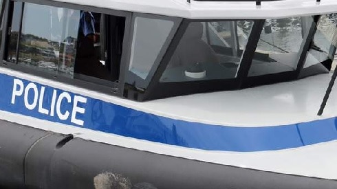 Word police on side of a boat.