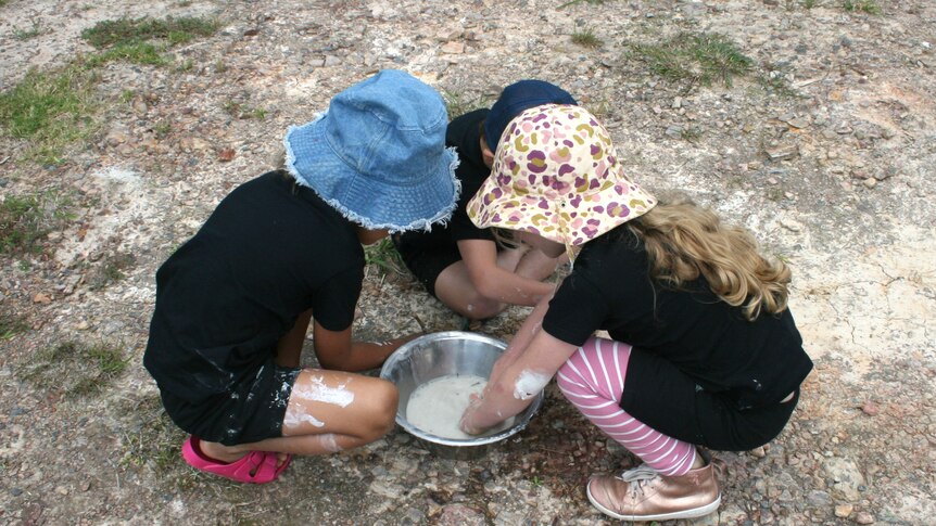 Children gathering water for play