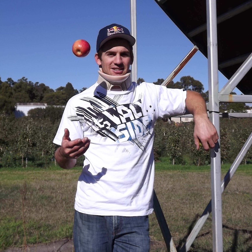 World motocross champion Josh Sheehan tosses an apple at the orchard in Donnybrook