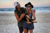 Australian snowboarder and Olympian Alex Pullin with his girlfriend Ellidy Vlug and their dog Rummi on the beach.