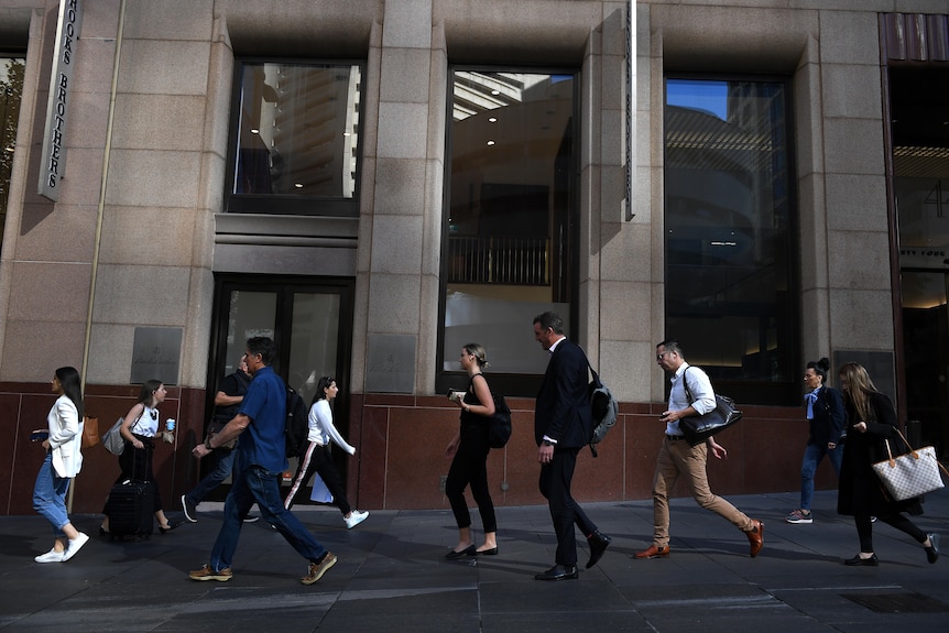 People are seen in the central business district of Sydney, Thursday, April 15, 2021.