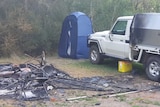 Camp site burn out, with burnt tent, chairs and other camping equipment. ute with minor fire damage.