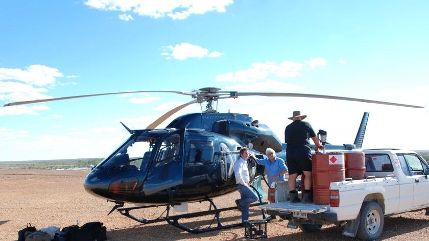 Gary Ticehurst (centre) with the ABC helicopter near Innaminka in South Australia, May 2009