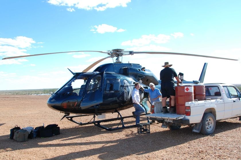 Gary Ticehurst (centre) with the ABC helicopter near Innaminka in South Australia, May 2009
