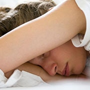 Girl sleeping with arm over face